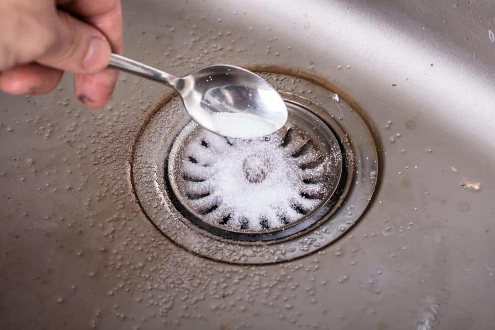 first step is to dump baking soda down the kitchen sink drain